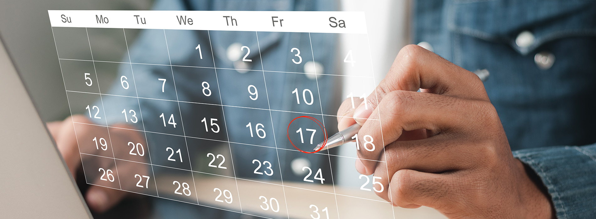 The image shows a person s hands holding a tablet with a calendar displayed, highlighting the month of July and circling the 17th day.